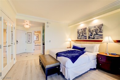 Bedroom with crown molding, light wood-style floor