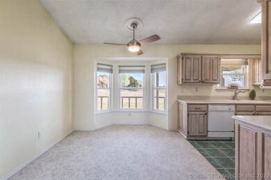 Dining area off kitchen has new ceiling fan, updat