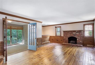 Spacious family room with wood floors and beautifu