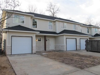 Townhome / multi-family property with stone siding