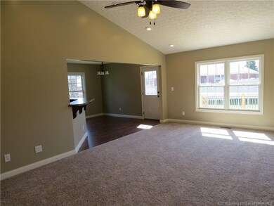 VIEW OF LIVING ROOM W/VAULTED CEILING...