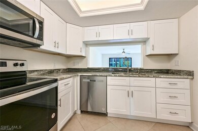 Kitchen featuring stainless steel appliances, a si