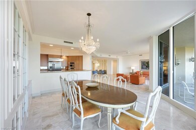 Dining area featuring ornamental molding and a cha