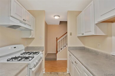 View towards entrance hall with wood flooring that