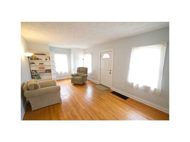 Entryway. Entry / living room with original built-