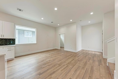 Unfurnished living room with recessed lighting an