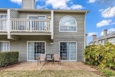 Rear view of house with a patio area and a balcony