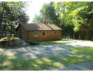Exterior Front. Road side of cottage