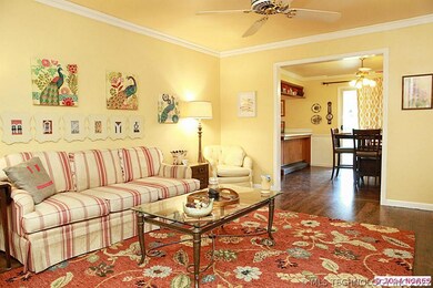 Spacious bright living area w/hardwoods & opens to