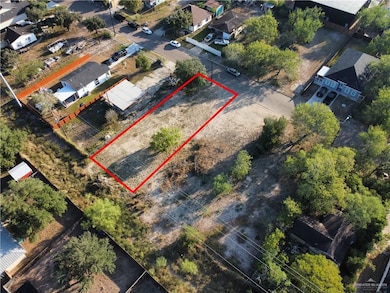 Aerial view of residential area with property parcel outlined