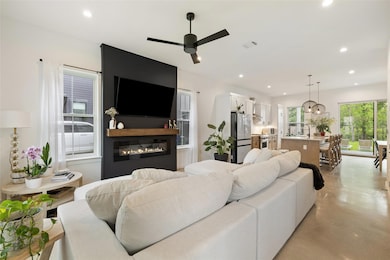 Living area with a glass covered fireplace, finis