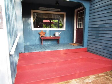 Covered main entrance porch connects...