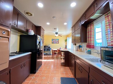 Vintage Spanish themed kitchen & dining area. 