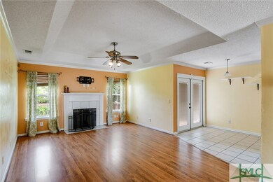 Wood burning fireplace with tile surround and wood