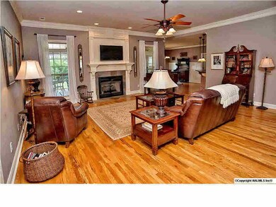 Relax in the family room with gas log fireplace, floor to ceiling windows, recessed lighting and 9' ceilings.