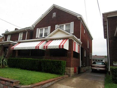 Exterior Front. It is on a lovely brick street.