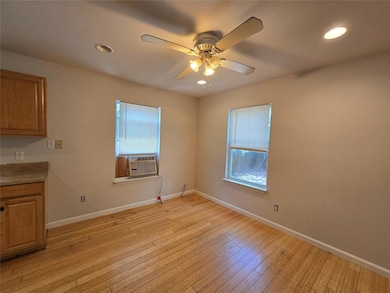Unfurnished dining area featuring cooling unit, h