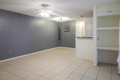 Empty room featuring a textured ceiling, ceiling 