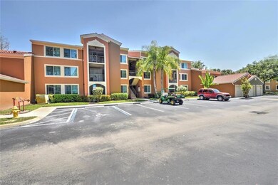 View of property featuring uncovered parking