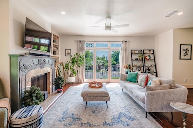 Living room featuring baseboards, a fireplace, a 