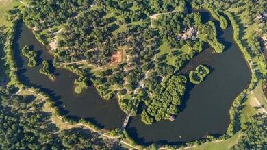 An aerial of the 25 +/- acre stunning Emerald Lake. Fabulous and a fisherman's dream!