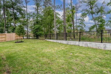 huge backyard that overlooks woods and pond area