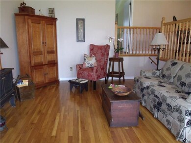 Living room with beautiful hardwood floors and cat