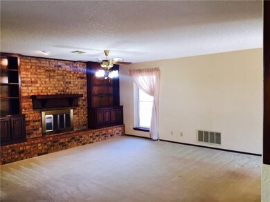 Humongous living area with a fireplace flanked by 