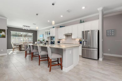 Huge granite island with room for 4+ charis under breakfast bar.