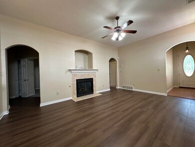 Unfurnished living room featuring a tile fireplace
