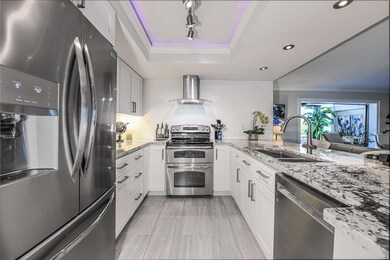 Kitchen with Stainless Appliances and tile floor.