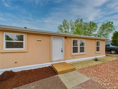 Charming stucco exterior with a beautifully landscaped front yard...