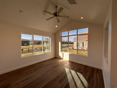 Unfurnished room featuring dark wood finished floors, vaulted ceiling, a ceiling fan, and recessed lighting