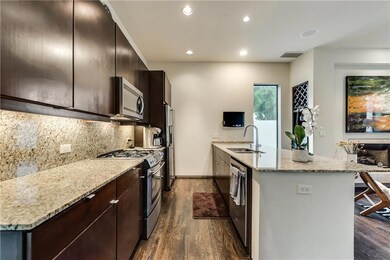 Sleek kitchen with a large island perfect for addi