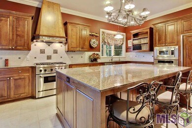 Custom maple cabinets line the kitchen walls.  Hig