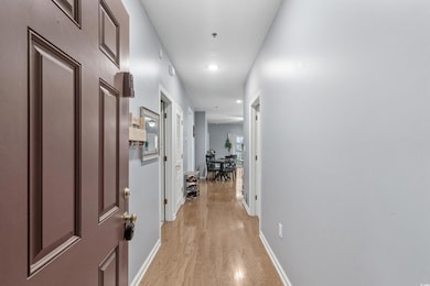 Hallway featuring light wood-type flooring