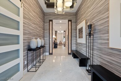 Corridor featuring wallpapered walls, tile pattern