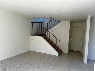 Stairs featuring tile patterned flooring, visible