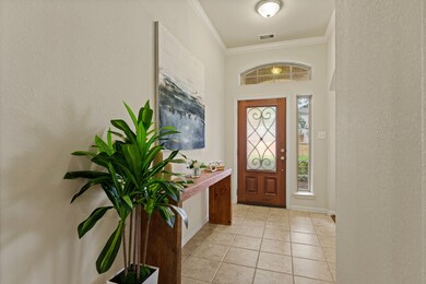 This foyer is a lovely space to welcome guests int