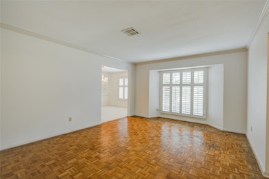 The formal living room is bright and features eleg