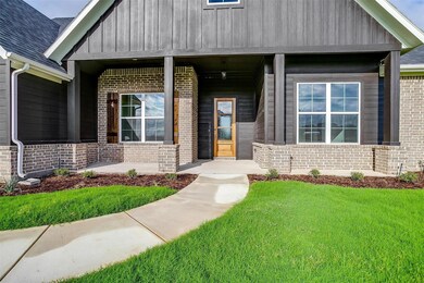 Doorway to property with a lawn