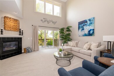 Main floor living space with soaring ceilings and 