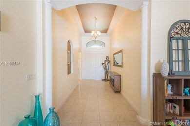 Double door entry leading into the Foyer with coff
