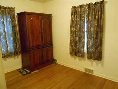 The second bedroom features ample windows, closet 