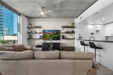 The room is styled with modern sophistication—plus