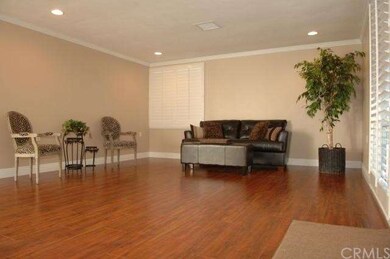 The expansive living room and dining area have ric