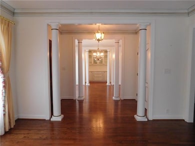 View from living room, through entry, into dining 