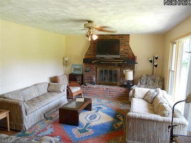 Very spacious living room with wood burning firepl