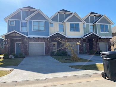 Townhome / multi-family property with brick siding