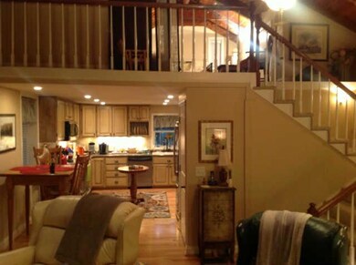 VIEW FROM LIVING ROOM INTO MODERN UPDATED KITCHEN